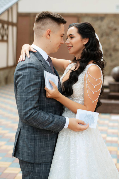 the first meeting of the bride and groom in the courtyard of a European hotel - Фото, зображення