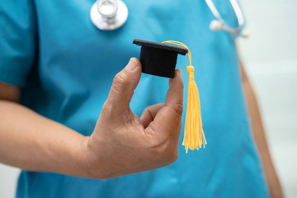 Asian doctor study learn with graduation gap hat in hospital ward, clever bright genius education medicine concept. - Фото, зображення