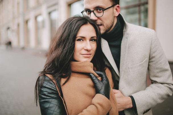 Young couple hugging on the city street in winter - Photo, Image