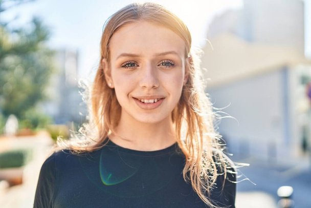 Young blonde woman smiling confident standing at street - Fotografie, Obrázek