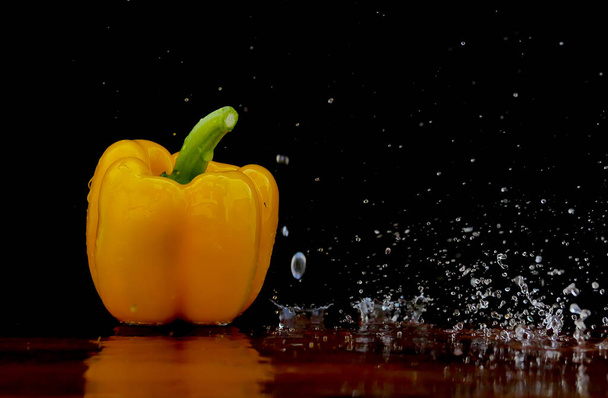 Yellow pepper in water stream - Fotó, kép