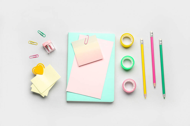 Composition with paper sheets and stationery on grey background - Photo, image