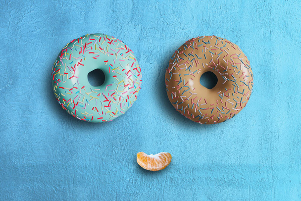 3D pink donut isolate on blue BG - Foto, Imagen