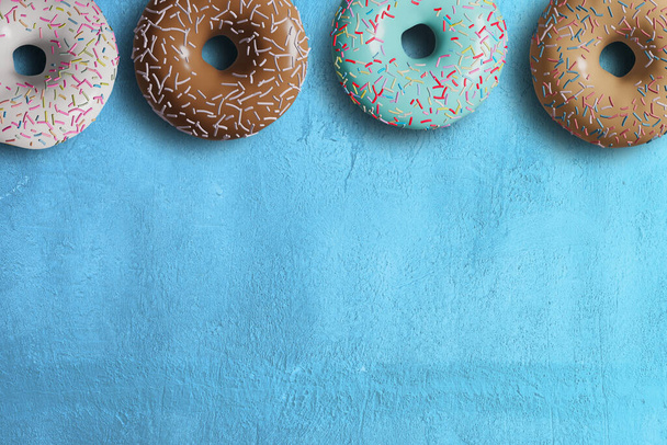 3D pink donut isolate on blue BG - Photo, Image