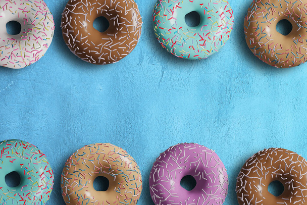 3D pink donut isolate on blue BG - Foto, Imagem