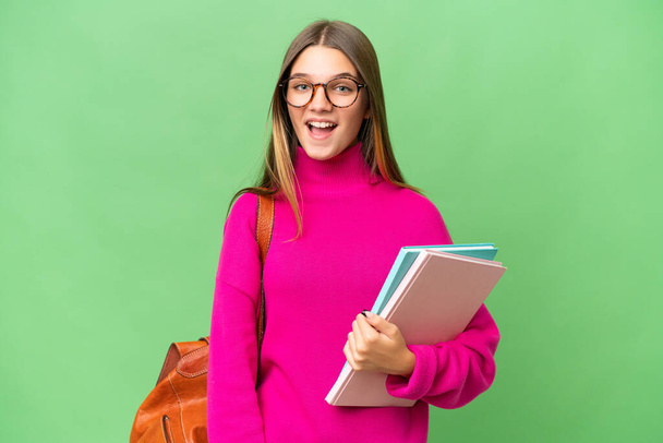 Teenager student caucasian girl over isolated background with surprise facial expression - Foto, afbeelding
