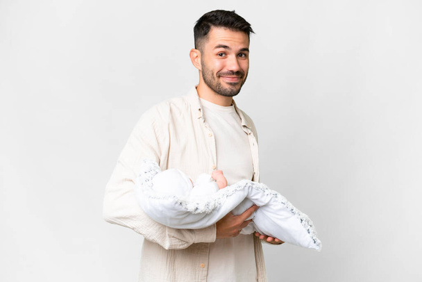 Young caucasian father with her newborn baby over isolated background with happy expression - Фото, изображение