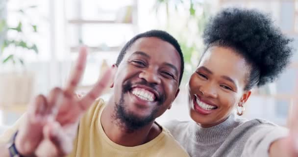 Black couple, smile and peace sign for selfie, vlog or social media post together with facial expressions at home. Portrait of happy, silly or goofy man and woman smiling with faces for photo moments. - Footage, Video