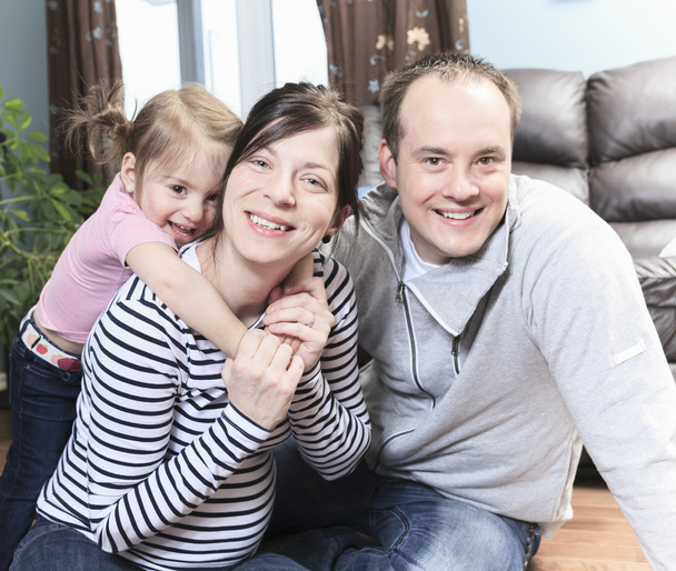 A Beautiful pregnant mother and family at home - Foto, Bild