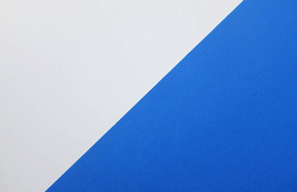 two tone blue white paper color for background. Two color paper with Overlay on the floor And split half of the image. background.Top view with place for text - Φωτογραφία, εικόνα