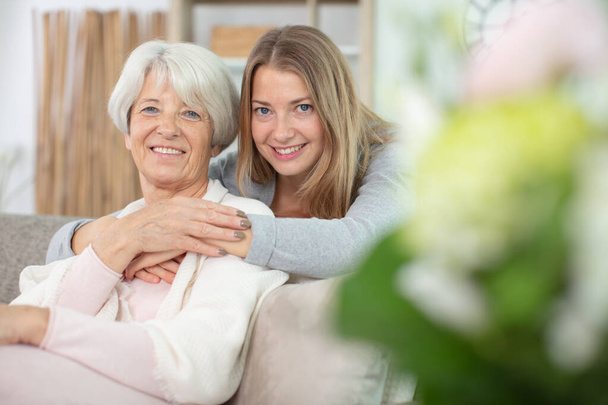 happy beautiful older mother and adult daughter looking at camera - Fotoğraf, Görsel