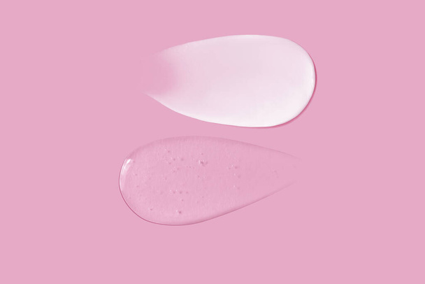 Smetana mazání textury a transparentní gel mazání textury na růžovém pozadí - Fotografie, Obrázek