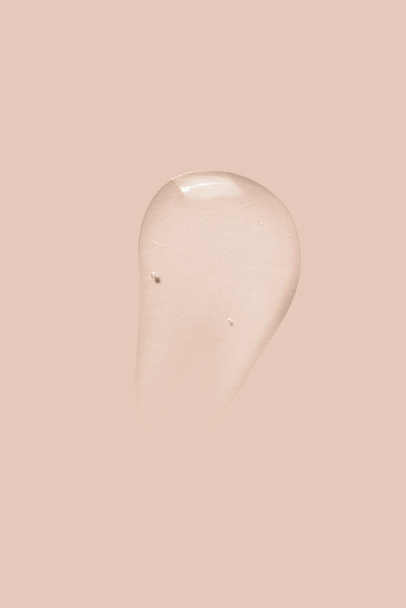 texture of a large smear of transparent gel on a beige background - Fotoğraf, Görsel