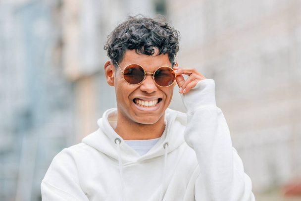 portrait young man with sunglasses on the street - Photo, Image
