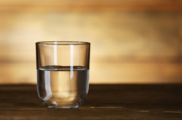 Glass of clean mineral water on rustic wooden background - Fotografie, Obrázek