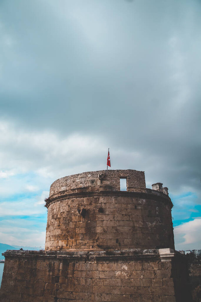 Close up of top of Hidirlik Tower in Antalya, Turkey during a cloudy day with copy space - Photo, Image
