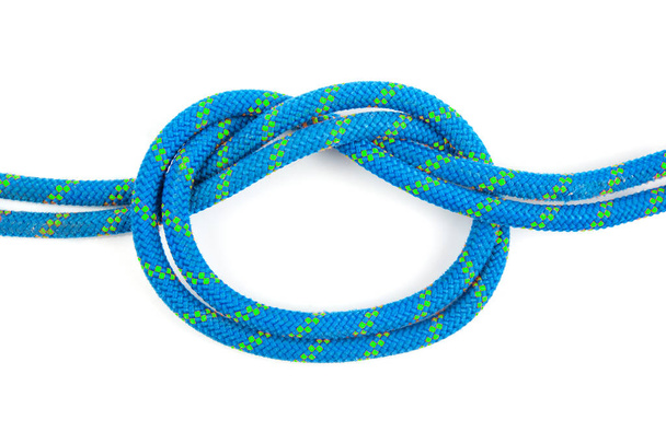durable colored rope for climbing equipment on a white background. knot of braided cable. item for tourism and travel - Fotografie, Obrázek
