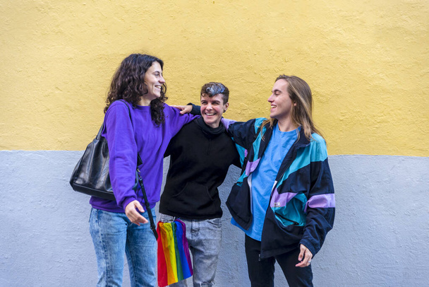Young diverse friends talking outdoors on the street. Lgbtq concept. - 写真・画像