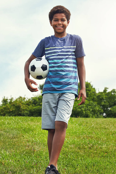 Are you ready for some football. a young boy out for a game of soccer in the park - Foto, Imagem