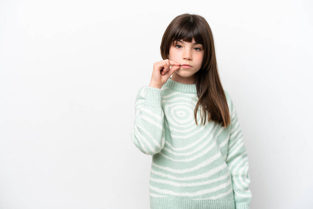 Little caucasian girl isolated on white background showing a sign of silence gesture - Fotoğraf, Görsel