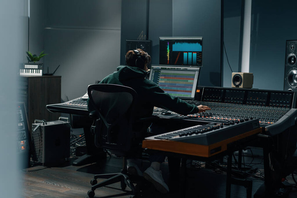 Sound engineer used digital audio mixer Sliders Engineer presses key Control panel Recording studio technician - Foto, Imagem