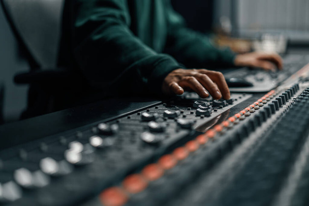 Sound engineer used digital audio mixer Sliders Engineer presses key Control panel Recording studio technician - Photo, Image