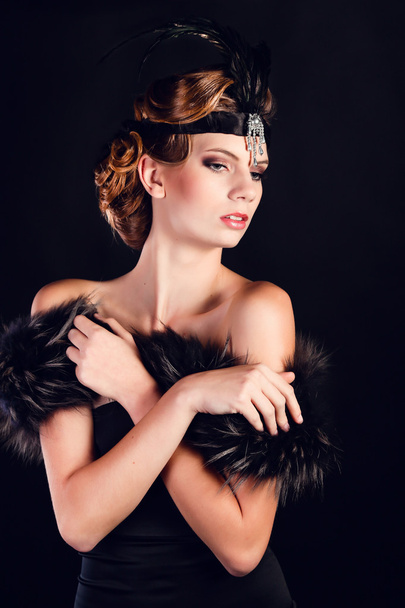 Elegant young woman in black lingerie posing at studio. - Zdjęcie, obraz