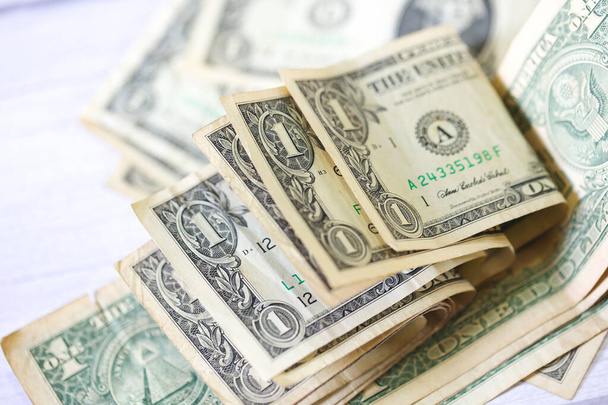 Κοντινό πλάνο του φόντου χρημάτων με χαρτονομίσματα του δολαρίου. Οικονομική και χρηματοπιστωτική έννοια. - Φωτογραφία, εικόνα