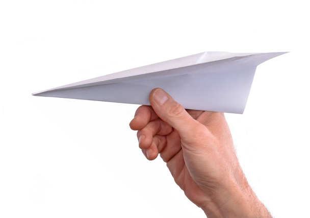 Hand throwing paper plane - Фото, изображение