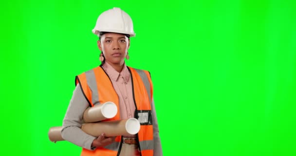 Face, woman and engineer with blueprints, green screen and planning against a studio background. Portrait, female or serious architect with confidence, construction and inspector documents on mock up. - Footage, Video