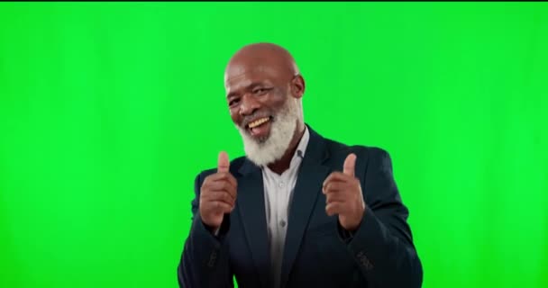 Thumbs up, face and man in a studio with green screen with success, winning or achievement. Happy, smile and portrait of African senior male model with approval hand gesture by chroma key background - Footage, Video