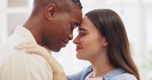 Hug, happy and an interracial couple in an embrace for love, gratitude and appreciation at home. Smile, together and a black man and woman hugging, embracing and being affectionate for closeness. - Footage, Video