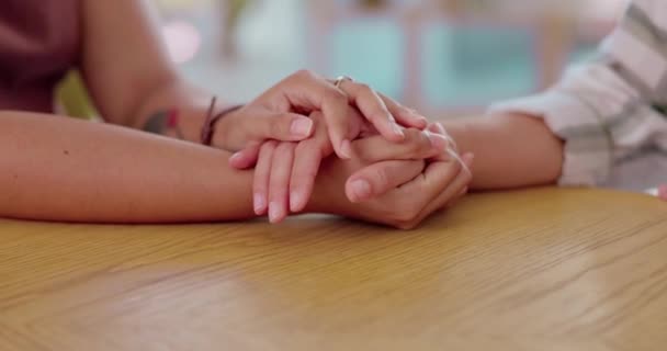 Love, trust and support with friends holding hands in comfort, care or help in a home together for empathy. Anxiety, depression or pray with a person consoling a friend through pain, loss or grief. - Footage, Video