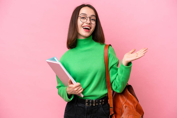 Young student Ukrainian woman isolated on pink background with shocked facial expression - Photo, Image
