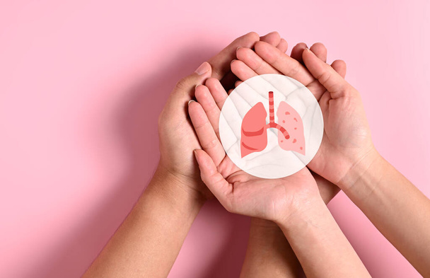 People holding lungs icon on hands, Concept of diagnostics, Treatment and support for lungs, Pulmonary hypertension, Health care service, Respiratory diseases, Internal donor organ - Фото, изображение