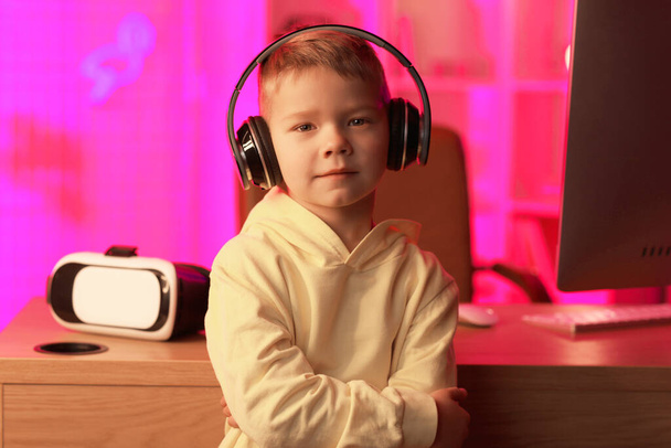Cute little blogger in headphones at home - Valokuva, kuva