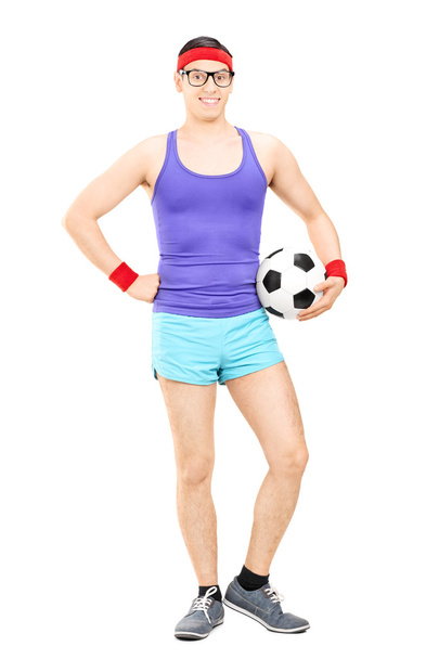 Nerdy athlete holding football - 写真・画像