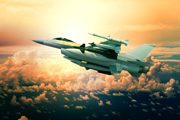 military jet plane with missile weapon flying against sunset sky - Photo, Image