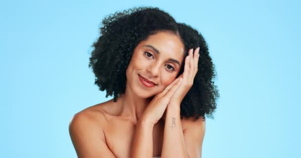 Rest, skincare and face of woman for beauty, wellness and natural facial treatment on blue background. Dermatology, spa and portrait of happy girl smile in studio for cosmetics, makeup and hair care. - Footage, Video