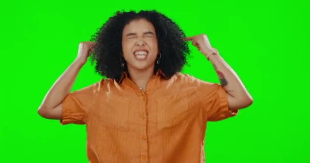 Rude, green screen and a woman shouting fuck you in studio while feeling angry, aggressive or upset. Screaming, hand gesture and insult with an unhappy afro female showing anger on chromakey mockup. - Materiał filmowy, wideo