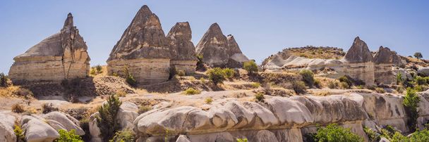 Unique geological formations in Love Valley in Cappadocia, popular travel destination in Turkey. BANNER, LONG FORMAT - Fotografie, Obrázek