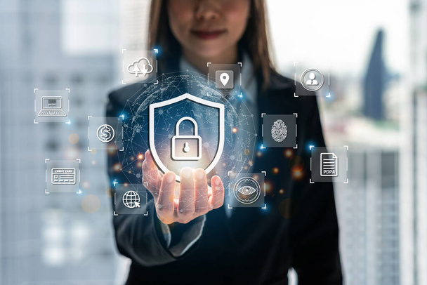 Businesswoman using smart devices with global network connection and cyber security business data protection technology - Foto, imagen