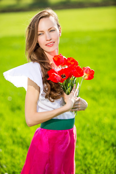 Woman with tulips - Фото, зображення