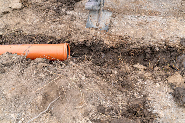 plastic pvc waste sewer pipe in the ground. High quality photo - Photo, Image