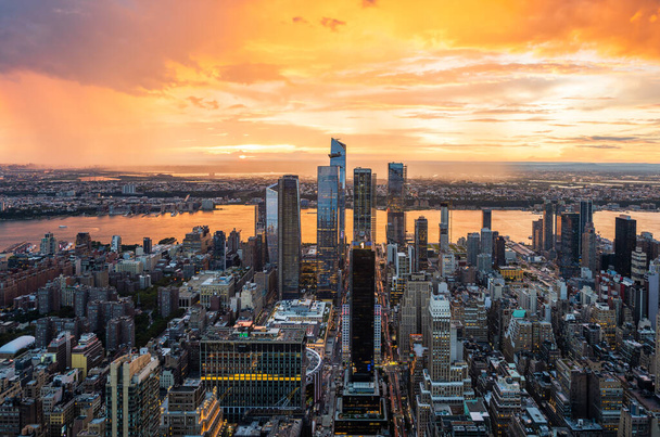 A beautiful colourful sunset during rainy storm over the Hudson Yards in New York City. - Photo, Image