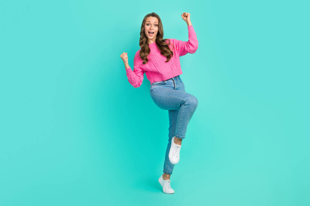 Full length photo of overjoyed positive girl celebrate low prices black friday empty space isolated on cyan color background. - Fotografie, Obrázek