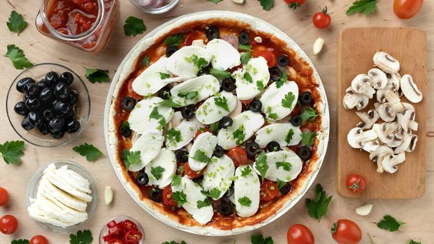 Recipe for making delicious Italian pizza with vegetables and mozzarella, flat lay, home cooking - Photo, Image