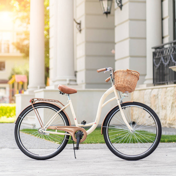 View of urban city bicycle parked on street in neighborhood. Sun bike summer. No people. - Foto, imagen