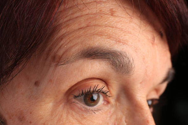 Skin care. Senior woman, closeup view of eye - 写真・画像