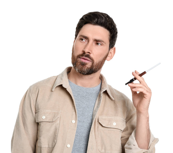 Man using cigarette holder for smoking isolated on white - Photo, image